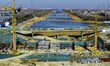 Workers are reinforcing the Yundong Gate at the construction site for the Subei Irrigation...