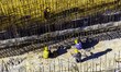 Workers are reinforcing the Yundong Gate at the construction site for the Subei Irrigation...