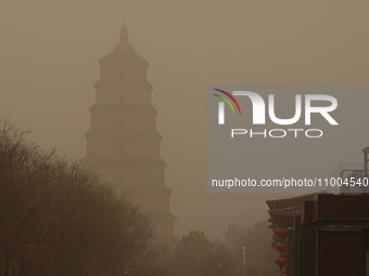 The Dayan Pagoda is looming under sand and dust in Xi'an, Shaanxi Province, China, on February 18, 2024. It is understood that at 6:58 on th...