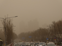 Vehicles are driving on a dusty day in Xi'an, Shaanxi Province, China, on February 18, 2024. It is understood that at 6:58 on the same day,...