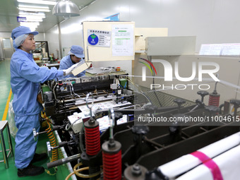 A worker is working in a production workshop at a pharmaceutical packaging company in Lianyungang, China, on February 18, 2024. (
