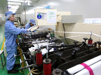 A worker is working in a production workshop at a pharmaceutical packaging company in Lianyungang, China, on February 18, 2024. (