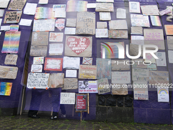 A hundred people are taking part in an art action to build an anti-AfD placards wall along the bank of the Rhine River in Dusseldorf, German...