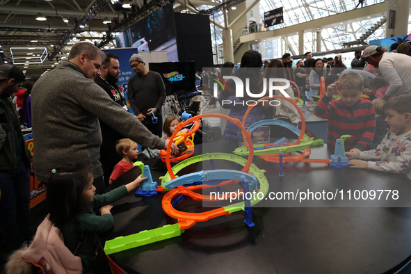 Children are playing with Hot Wheels cars at the Canadian International Auto Show in Toronto, Canada, on February 19, 2024. 