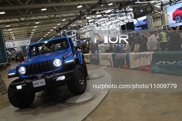Visitors are experiencing a performance of Jeep off-road vehicles at the Canadian International Auto Show in Toronto, Canada, on February 19...