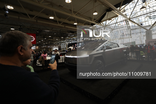Visitors are taking photos and videos of the Tesla Cybertruck at the Canadian International Auto Show in Toronto, Canada, on February 19, 20...