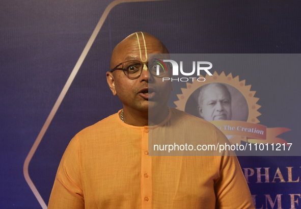 Indian monk Gour Gopal Das is reacting during a photoshoot at the red carpet event of the 'Dadasaheb Phalke International Film Festival Awar...