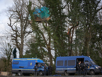 Gendarmes Mobiles are standing guard near the 'Crem'Arbre' ZAD under a hut occupied by 'Ecureuils' in the woods in Saix, Tarn, France, on Fe...