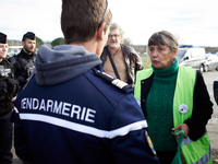 A member of the LDH is discussing with a Lt-Colonel of the Gendarmerie Mobile to provide medical supplies to an 'Ecureuil' living in a tree...