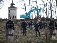 NGE/ATOSCA is working under heavy police protection in the woods in Saix, Tarn Departement, on the planned A69 highway between Toulouse and...