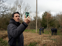 Thomas Brail, an activist and arborist climber, is filming to show the heavy police presence near the 'Crem'Arbre' ZAD in the woods in Saix,...