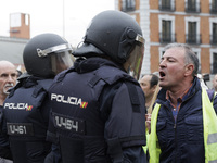 Farmers are protesting in front of the police during the Spanish farmers' protest in Madrid, Spain, on February 21. (