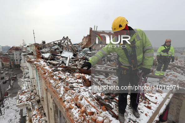 Experts from the Kharkivspetsbud utility company are working to address the aftermath of Russian shelling in one of the emergency residentia...