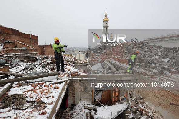 Experts from the Kharkivspetsbud utility company are working to address the aftermath of Russian shelling in one of the emergency residentia...