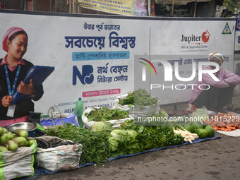 An Indian vegetable vendor is selling vegetables at a roadside stall in Siliguri, India, on February 22, 2024. (