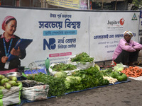 An Indian vegetable vendor is selling vegetables at a roadside stall in Siliguri, India, on February 22, 2024. (