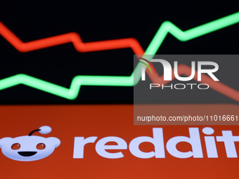 An illustrative stock graph and Reddit logo displayed on a phone screen are seen in this illustration photo taken in Krakow, Poland on Febru...