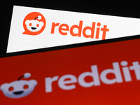 Reddit logo on website displayed on a laptop screen and Reddit logo displayed on a phone screen are seen in this illustration photo taken in...