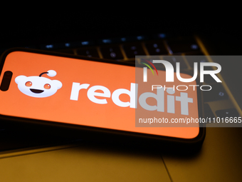 A laptop keyboard and Reddit logo displayed on a phone screen are seen in this illustration photo taken in Krakow, Poland on February 22, 20...