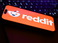 A laptop keyboard and Reddit logo displayed on a phone screen are seen in this illustration photo taken in Krakow, Poland on February 22, 20...