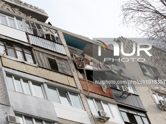 A block of flats in Dnipro, Ukraine, is showing damage after being hit by a Russian Shahed drone in an overnight attack on February 23, 2024...