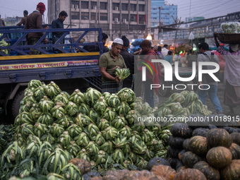 A vendor is selling cauliflowers at the Kawran Bazar wholesale market in Dhaka, Bangladesh, on February 23, 2024. (