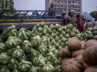 A vendor is selling cauliflowers at the Kawran Bazar wholesale market in Dhaka, Bangladesh, on February 23, 2024. (