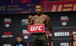 Mateus Mendonca of Brazil is posing on the scale during the UFC Fight Night ceremonial wei...