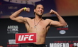 Brian Ortega is posing on the scale during the UFC Fight Night ceremonial weigh-in at CDMX...