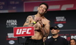 Brandon Moreno of Mexico is posing on the scale during the UFC Fight Night ceremonial weig...