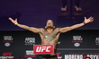 Felipe dos Santos of Brazil is posing on the scale during the UFC Fight Night ceremonial w...
