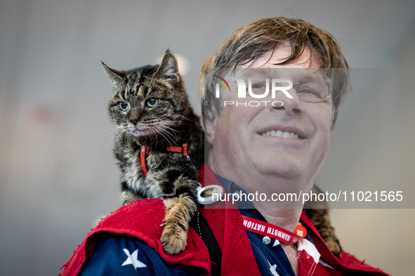 Erik Svane, a resident of France,and his 19-year-old cat, Jixie Juny, attend the annual Conservative Political Action Conference (CPAC) in N...