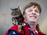 Erik Svane, a resident of France,and his 19-year-old cat, Jixie Juny, attend the annual Conservative Political Action Conference (CPAC) in N...