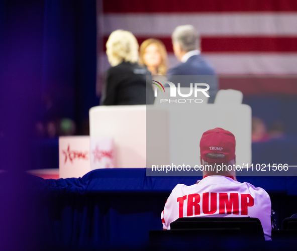 A Trump supporter listens to a panel on the Bible at the annual Conservative Political Action Conference (CPAC) in National Harbor, MD, Febr... by Allison Bailey/NurPhoto