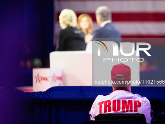 A Trump supporter listens to a panel on the Bible at the annual Conservative Political Action Conference (CPAC) in National Harbor, MD, Febr...