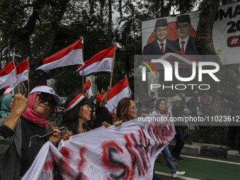 Protesters are shouting slogans during a rally against the preliminary results of the recent general election, which they claim are fraudule...