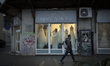 People walk past a store with wedding dresses in Warsaw, Poland on 21 February, 2024. 