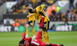 Nelson Semedo of Wolves is helping Vinicius Souza of Sheffield United after he got injured...