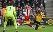 Anel Ahmedhodzic of Sheffield United (C) and Toti of Wolves are in action during the Premi...