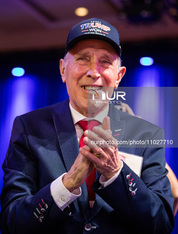 A man applauds Steve Bannon at the annual Conservative Political Action Conference (CPAC) in National Harbor, MD, February 24, 2024.  A rost... by Allison Bailey/NurPhoto