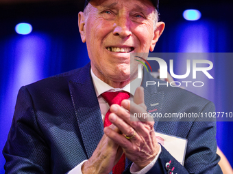 A man applauds Steve Bannon at the annual Conservative Political Action Conference (CPAC) in National Harbor, MD, February 24, 2024.  A rost... by Allison Bailey/NurPhoto