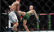 Daniel Lacerda of Brazil is kicking Edgar Chairez of Mexico in a flyweight fight during th...