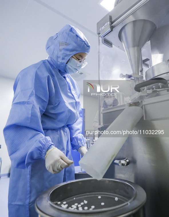 A college student is participating in a pharmaceutical production competition in Huai'an, China, on February 27, 2024. 