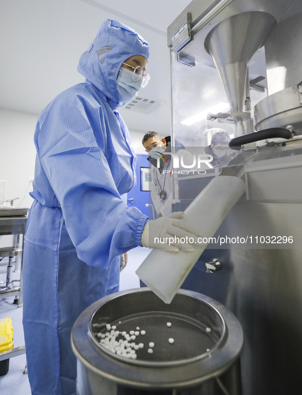 A college student is participating in a pharmaceutical production competition in Huai'an, China, on February 27, 2024. 
