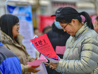 Job seekers are learning about jobs at a job fair held by the Qingzhou Federation of Trade Unions in Shandong Province, East China, on Febru...