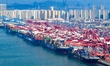 Containers are being loaded and unloaded at the Qianwan Container Terminal of Qingdao Port...