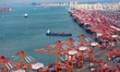 Containers are being loaded and unloaded at the Qianwan Container Terminal of Qingdao Port...