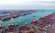 Containers are being loaded and unloaded at the Qianwan Container Terminal of Qingdao Port...