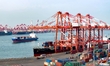 Containers are being loaded and unloaded at the Qianwan Container Terminal of Qingdao Port...