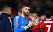 Matt Turner of Nottingham Forest is looking dejected as he applauds his team's supporters...